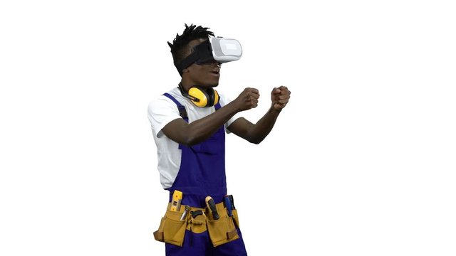 Engineer african american with virtual reality glasses looks at the building . Alpha channel