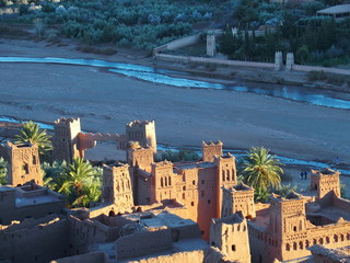 Kasbah Ait Ben Haddou and view of river at oasis on african countryside landscape in Morocco