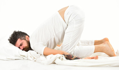 Man with beard and mustache fall asleep bending his knees