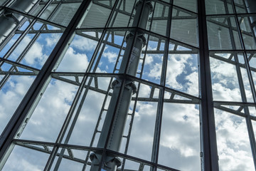 The glass architecture in city against a sky