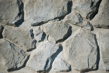Gray stone wall background. Texture of painted brick.