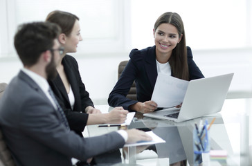 business partners discussing documents and ideas at meeting