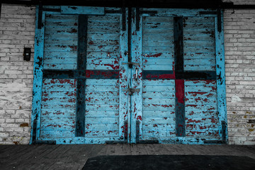 Old wooden gate with faded paint