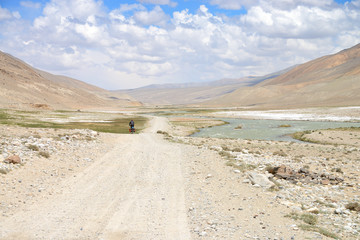 Long distance cycling in the Wakhan valley, Pamir Mountain Range, Tajikistan