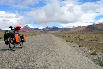 Fototapeta premium Long distance cycling on M41 Pamir Highway, Pamir Mountain Range, Tajikistan