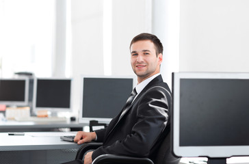 HR Manager sitting in a modern office before the start of the working day