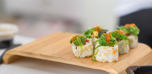 Delicious sushi, japanese food with raw fish, avocado and rice