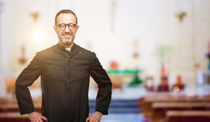 Priest religion man confident and happy with a big natural smile laughing at church