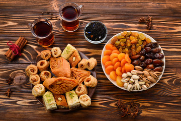 Turkish sweet baklava on plate with Turkish tea.