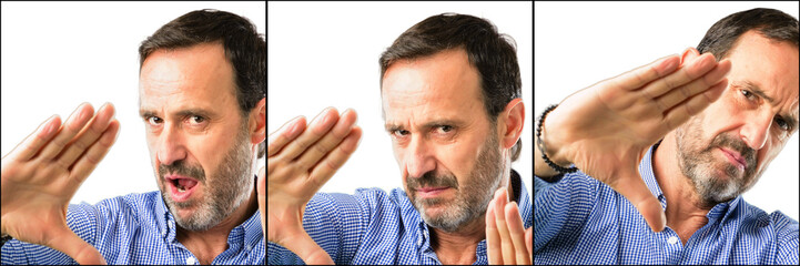 Middle age handsome man closeup confident and happy showing hands to camera, composing and framing gesture