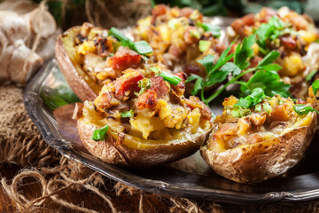 Baked potatoes stuffed with bacon, mushrooms and cheese