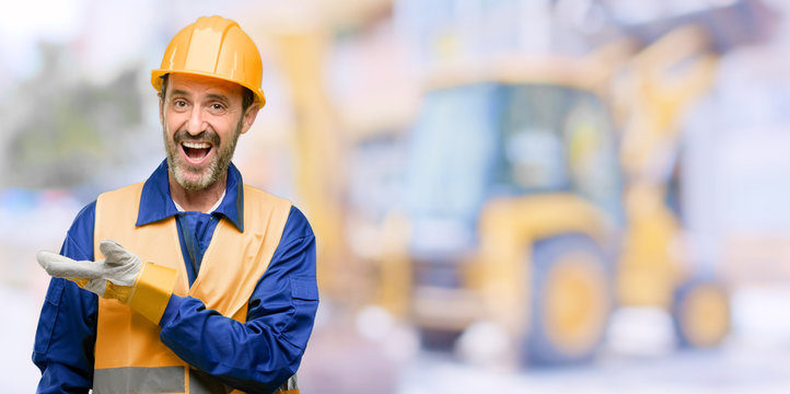 Senior engineer man, construction worker holding something in empty hand at work