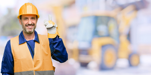 Senior engineer man, construction worker raising finger, the number one at work