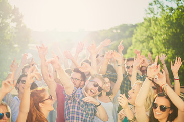 Group of people dancing and having a good time at the outdoor party/music festival