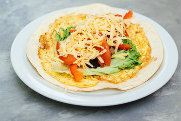 Homemade opened pita with salad, tamato, cheese. Healthy food concept.