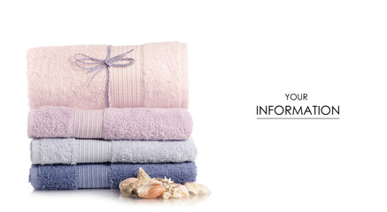 Fototapeta na wymiar A stack of towels pink blue spa sea seashell stones pattern