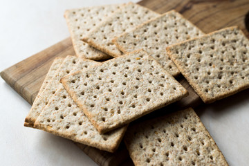 Stack of Honey Flavored Graham Crackers on Wooden Surface.