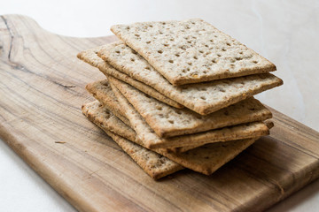 Stack of Honey Flavored Graham Crackers on Wooden Surface.