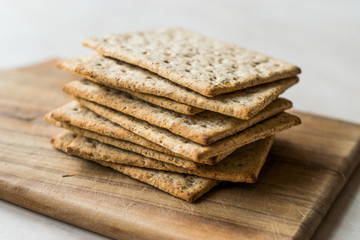 Stack of Honey Flavored Graham Crackers on Wooden Surface.