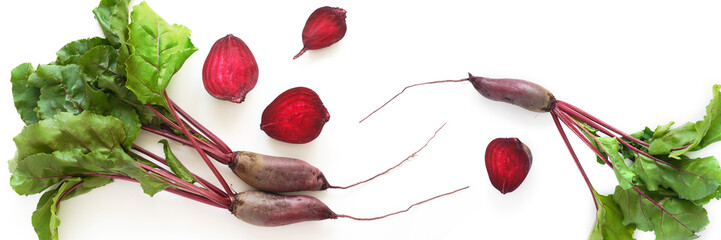 Composition of fresh beets with tops and beets in a cut isolated on a white background. Healthy...