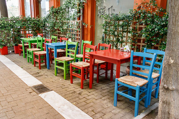 Fototapeta na wymiar Wooden Tables and Chairs outdoors.
