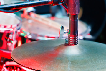 A drums silver plate with a microphone closeup.