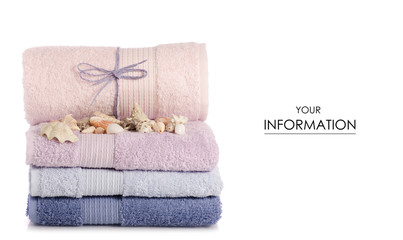 Fototapeta na wymiar A stack of towels pink blue spa sea seashell stones pattern