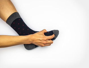 Ankle pain with sock and hand massaging