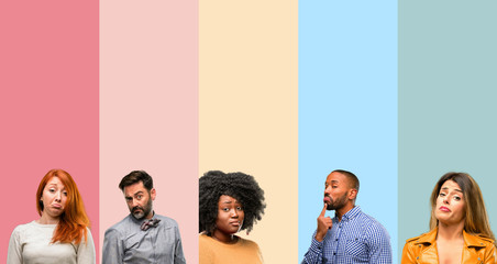 Cool group of people, woman and man having skeptical and dissatisfied look expressing Distrust,...