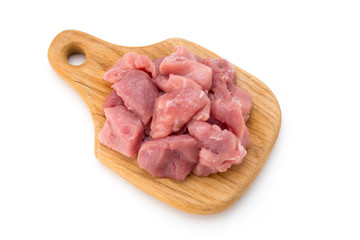 Raw chopped beef meat pieces isolated om white background cut out.