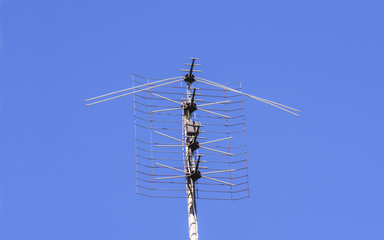 Old antenna on the sky background