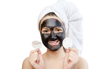  funny close-up portrait beautiful woman with facial black mask on white background, girl with a...