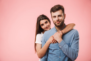 Portrait of a smiling young couple hugging