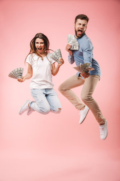 Full length portrait of an excited young couple