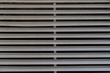 Obraz premium Blinds on the building on the hatch for ventilation.