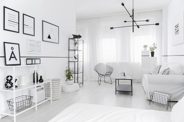 Posters in white living room