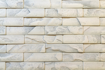 Wall of white brick. background. Wall of white-gray brick.