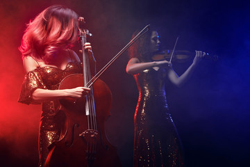 Fototapeta premium The cellist girl performs on stage.