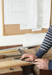 carpenter drawing on a wooden board.copy space