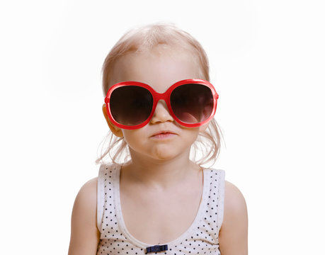 Portrait of cute caucasian baby 2-3 year old with big sunglasses on face. Isolated on white background