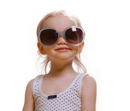Portrait of cute caucasian baby 2-3 year old with big sunglasses on face. Isolated on white background