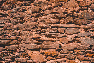 ancient stone facade texture in brown colors