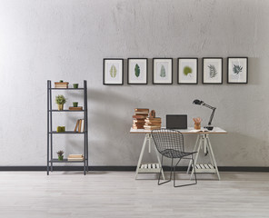 decorative office style grey wall and laptop decoration with books.
