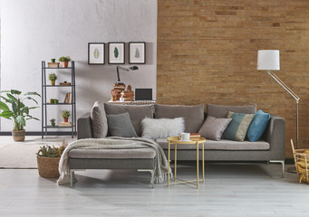 modern two side home design yellow brick wall and grey background. Grey armchair loft style.