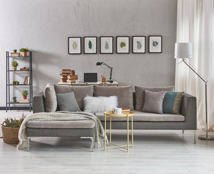 decorative grey details living room with armchair and coffee table.