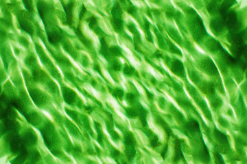 Green water ripples abstract pattern background.