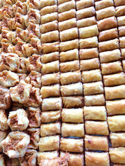 Two differents kinds of baklavas shot in the pastries shop. Closeup