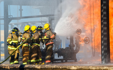 Fire fighters battling a blaze at oil pipeline refinery 