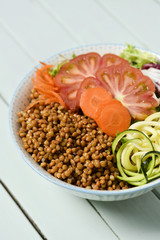 buddha bowl on a pale green table