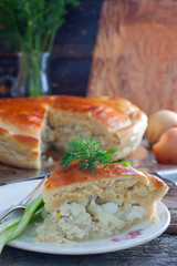 Closed yeast dough cake with fish, selective focus